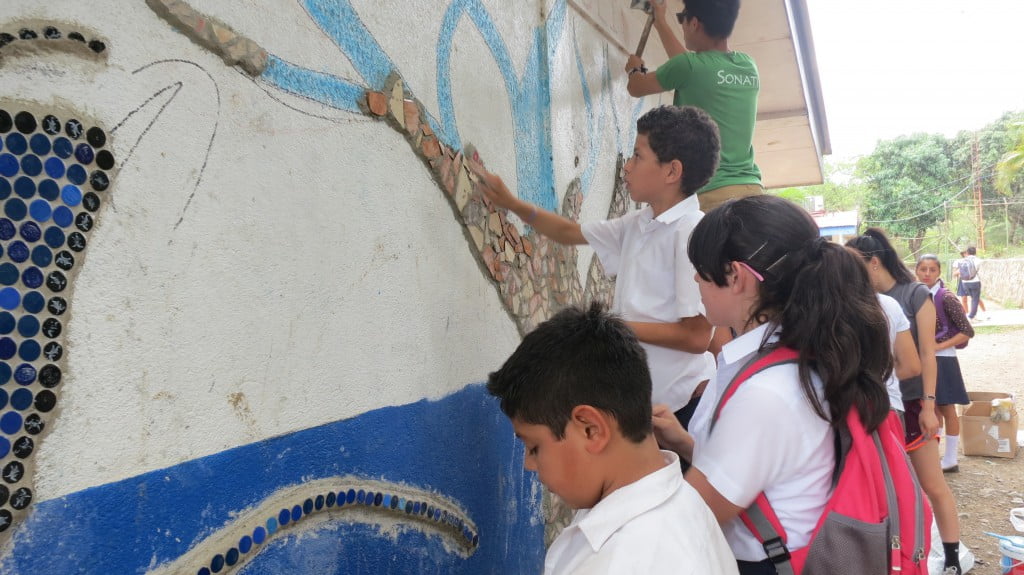 Santa Cruz students helping with the mural