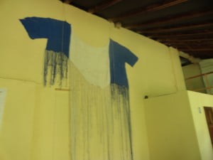 Shirt being weaved from plastic bags.