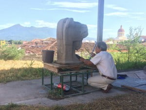 This artist is making a replica of a stone statues that were found all over Granada. These were made by indigenous people during pre colonial times.