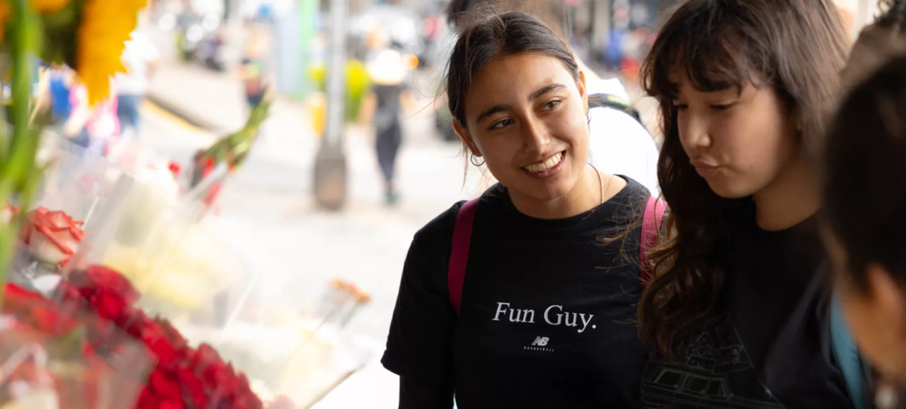 Student smiling and looking at someone off camera
