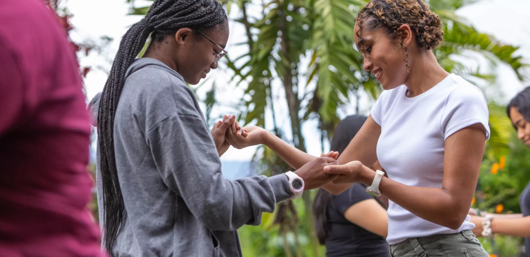 Maddy Lambert in country holding hands with a fellow student