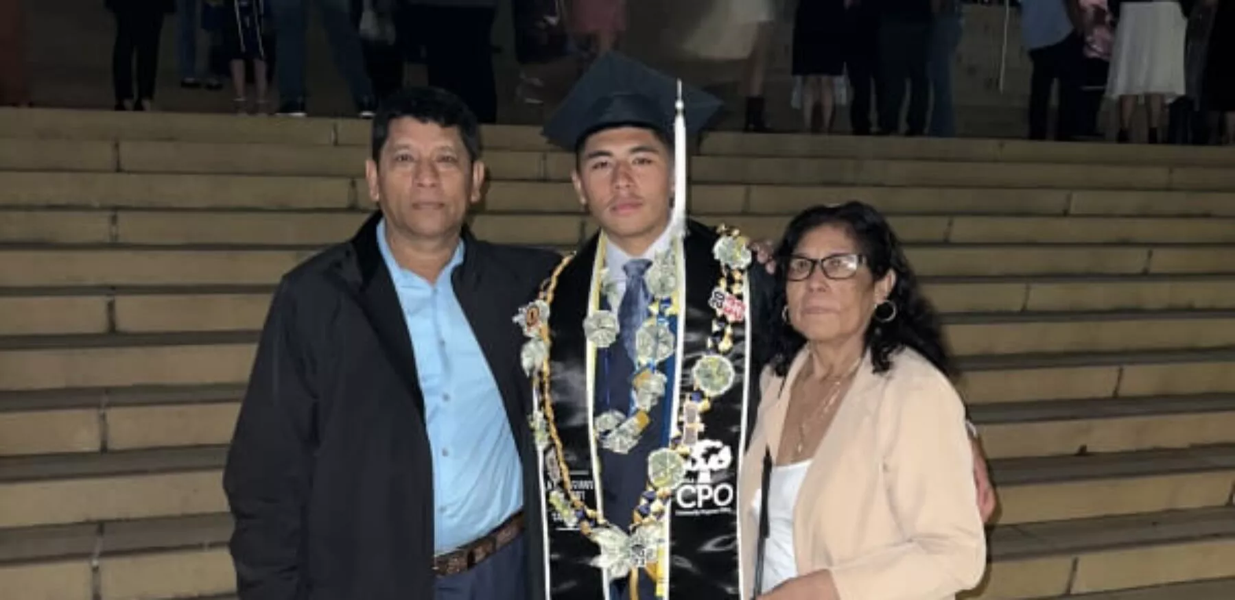 Anthony Bibiano with parents at college graduation
