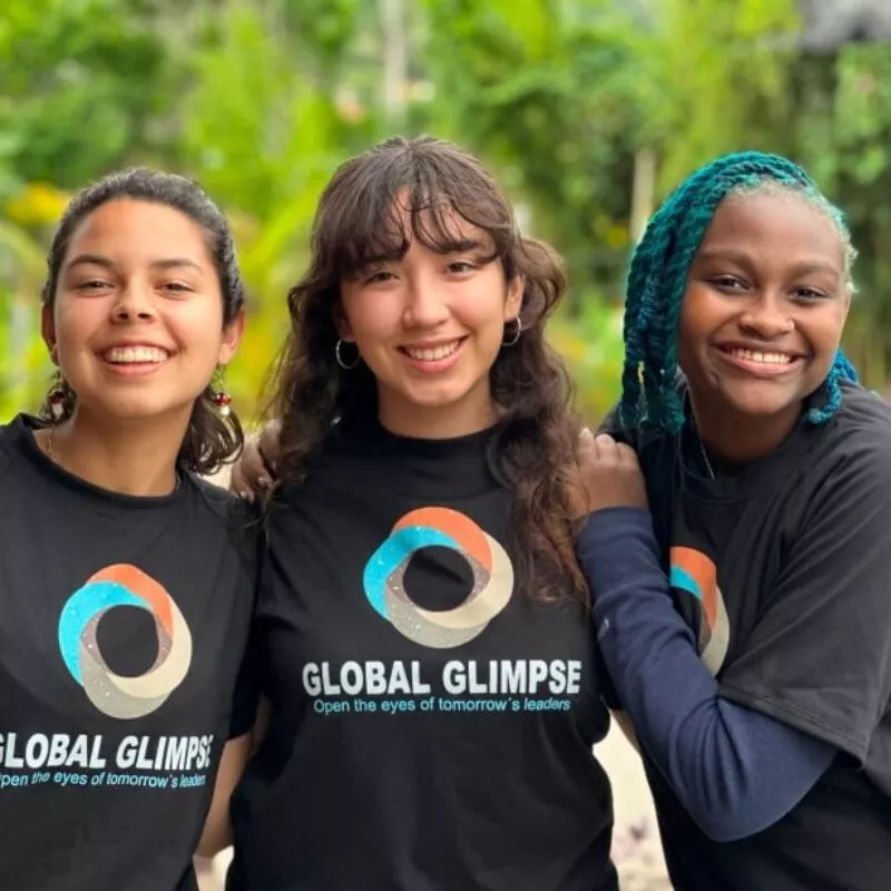 Three teenage girls-smiling in Global Glimpse T shirts